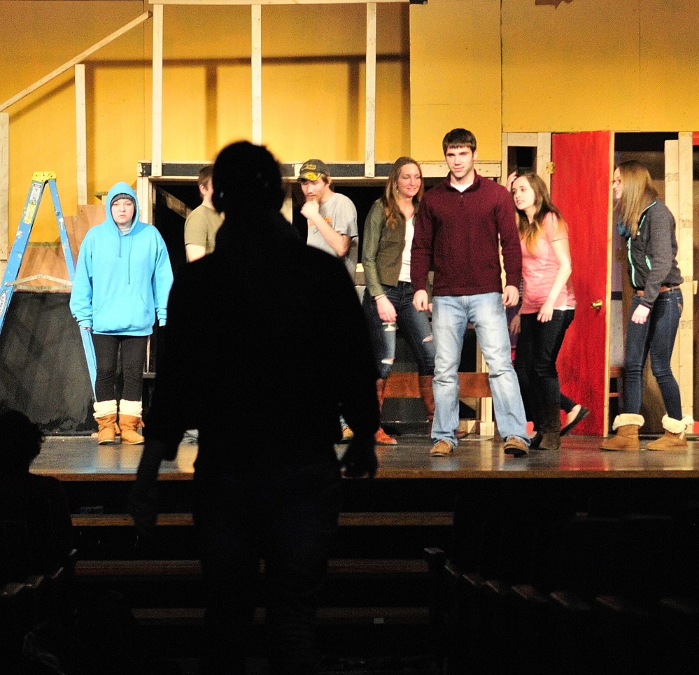 Under the Bard walk: A student makes an entrance down the center of the stage Friday during rehearsal of a scene from “Romeo and Juliet” for Lit Fest in the Little Theater at Gardiner Area High School in Gardiner.
