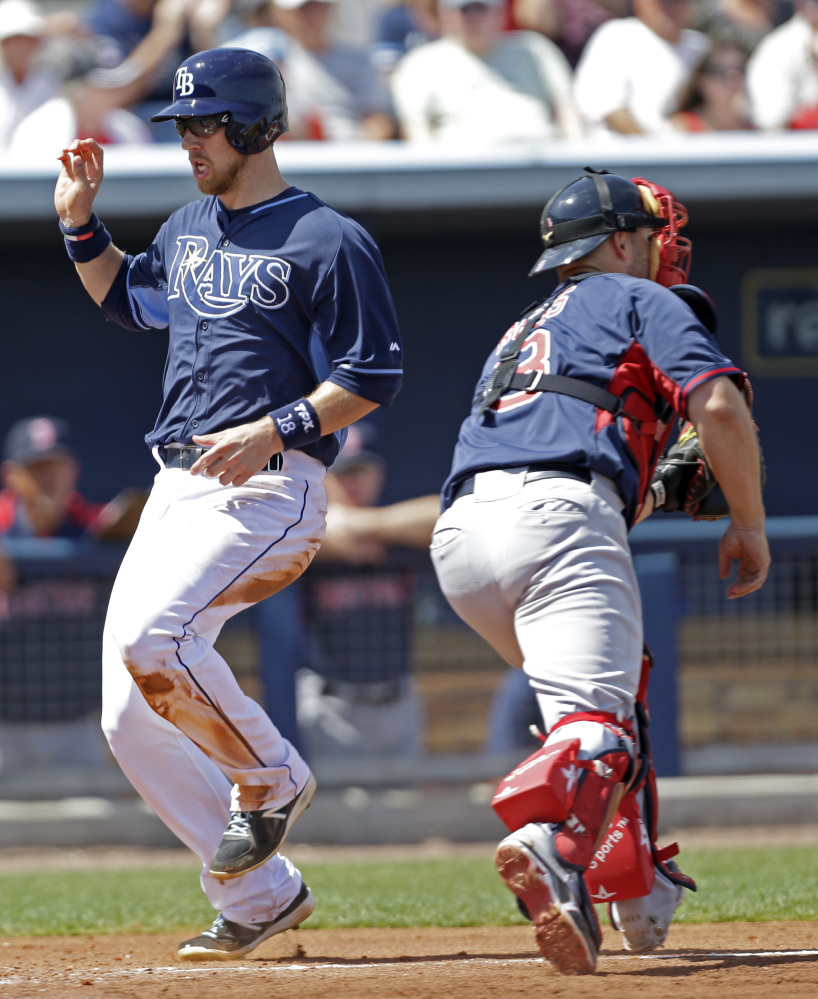 TOUGH DAY: Tampa Bay Rays Ben Zobrist (18) scores as Boston Red Sox catcher David Ross (3) covers the plate on a two run RBI double by James Loney in the fifth inning Sunday of an exhibition game in Port Charlotte, Fla. The Rays won 8-4.