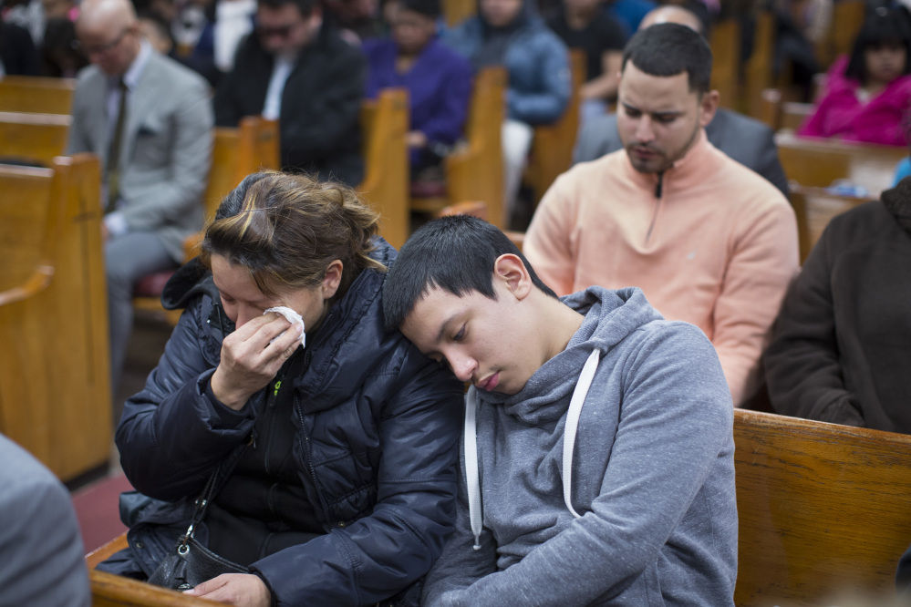 Parishioners mourn during Sunday services at the Church of God of Third Avenue as the congregation welcomed members of the Spanish Christian Church that was destroyed by Wednesday’s explosion in New York City.
