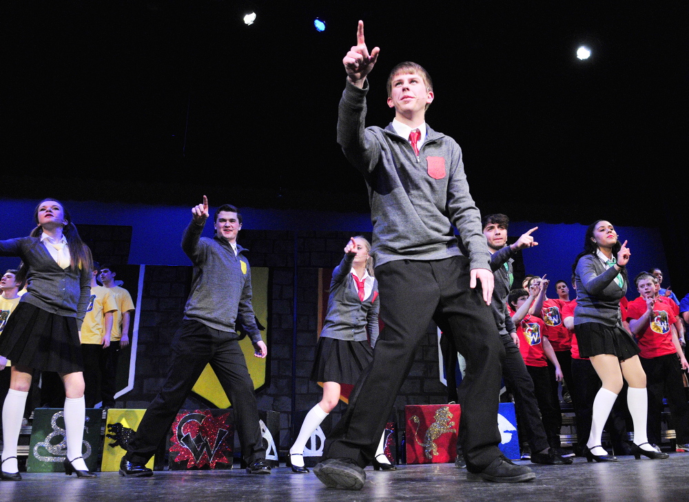 Looking ahead: Josh Cormier sings “Baby You Fly My Car” during a Chizzle Wizzle rehearsal Friday at Cony High School in Augusta. The show has a Harry Potter theme and the song was an adaption of the Beatles song “Baby You Can Drive My Car.”