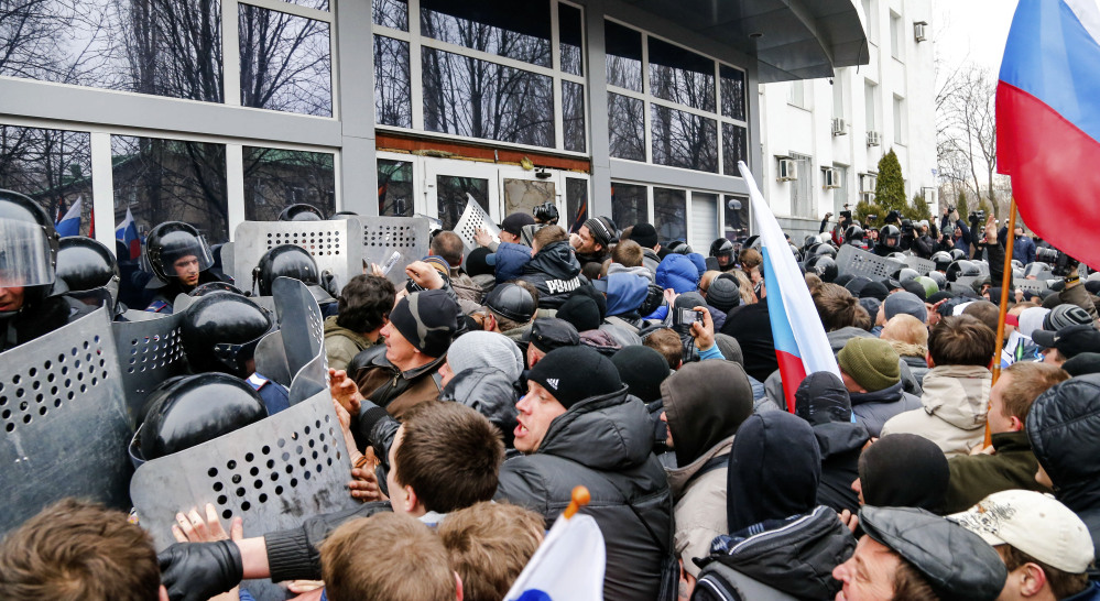 Pro-Russia demonstrators storm the Security Service building Sunday in Donetsk, a key city in eastern Ukraine. The demonstrators called for a secession referendum similar to the one in Crimea, which could lead to further divisions in the Ukrainian nation of 46 million.