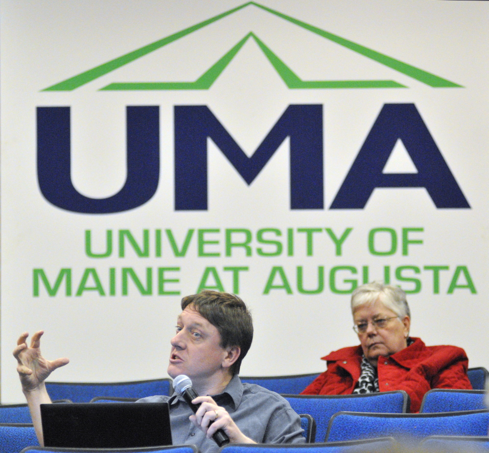 UMA cuts: James Cook, a social sciences professor, asks a question during a meeting about proposed budget cuts on Wednesday in Jewett Hall at the University of Maine at Augusta.