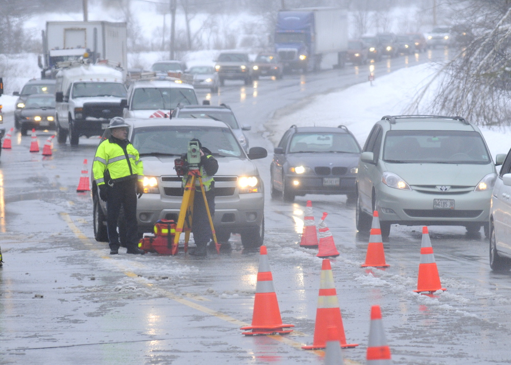 morning accident: Police reconstruct a two-car accident that claimed the life of a man and injured a woman on Route 202 in Winthrop.