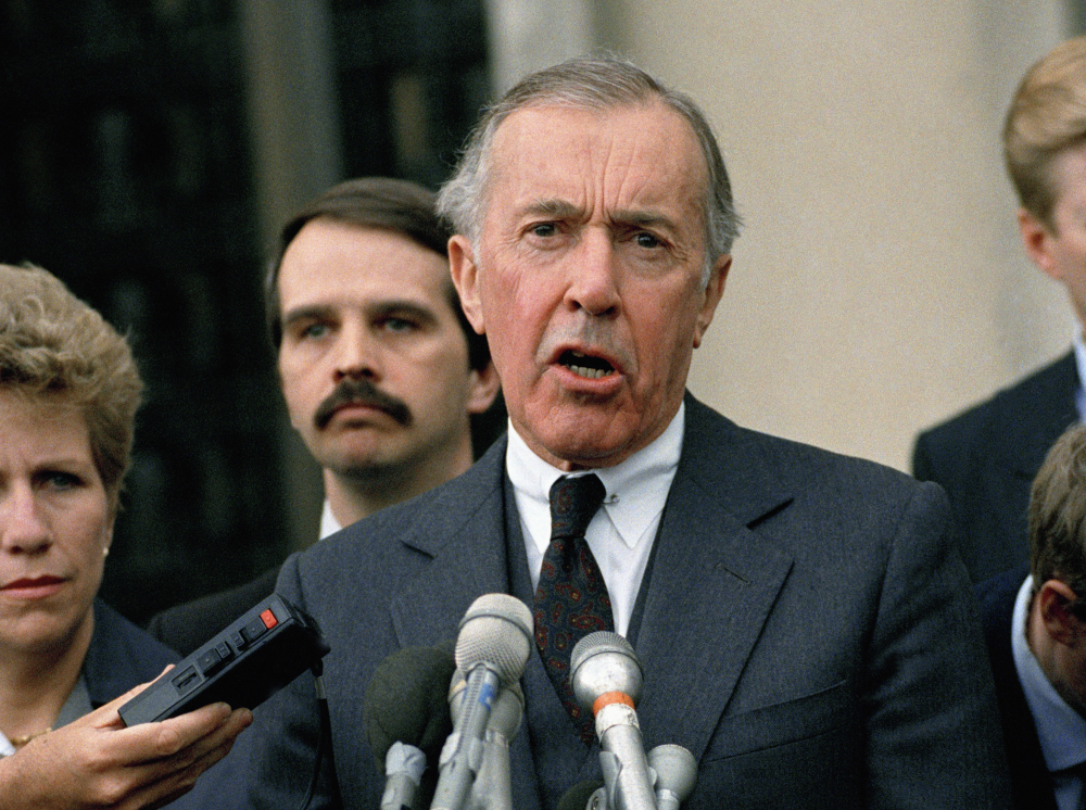 Lawrence Walsh, then the Iran-Contra special prosecutor, speaks to reporters outside U.S. District Court in Washington in 1989. Walsh charged 14 people with criminal offenses during the investigation, mostly for lying or withholding information from Congress. Eleven pleaded guilty or were convicted, though the two most high-profile targets, Oliver North and John Poindexter, had their convictions overturned on appeal.