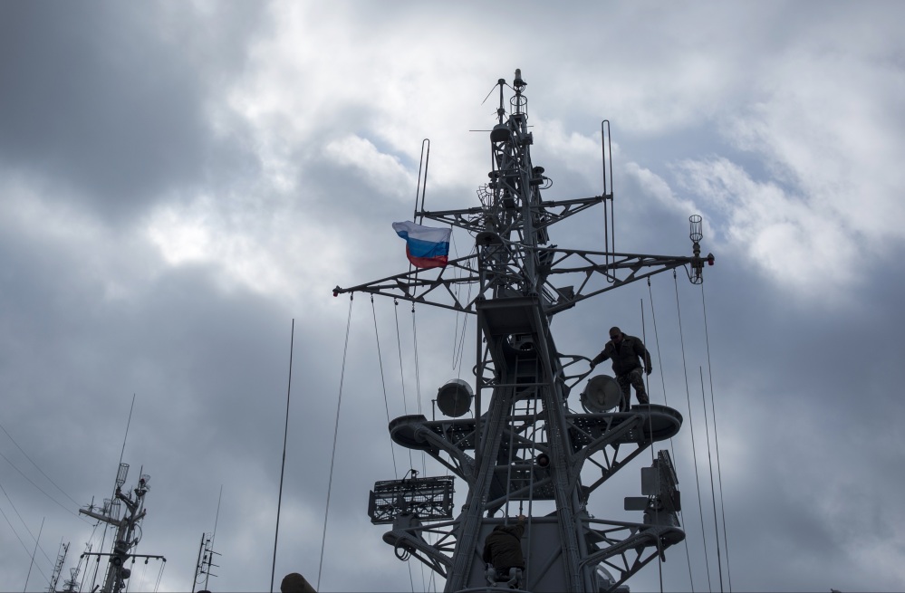 Pro-Russian forces raise a Russian flag after seizing the Ukrainian corvette Khmelnitsky in Sevastopol, Crimea, Thursday.
