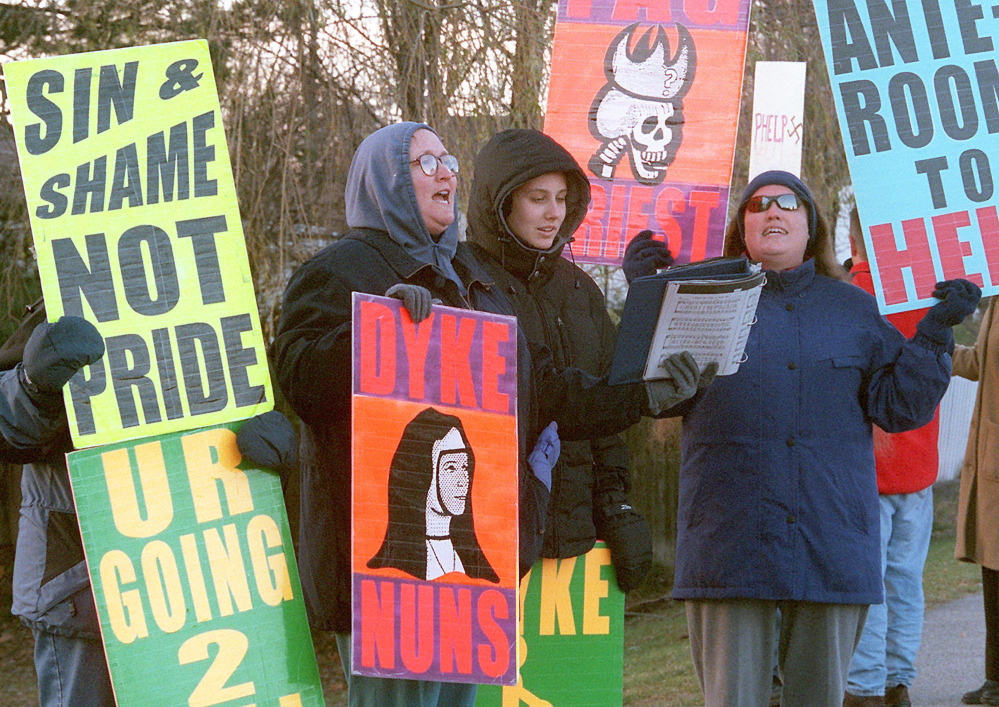 Parishioners from the Westboro Baptist Church of Topeka, Kan., sing hymns while picketing St. Andrews Presbyterian Church in Kennebunk on a Sunday morning in November 2000. They said they were protesting Question 6, the proposed gay rights law that voters rejected on Election Day that year.