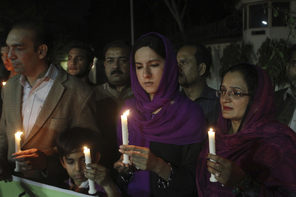 Pakistanis hold candles for the passengers of a Malaysia Airlines plane that disappeared on March 8, while holding a candlelight vigil organized by Peace for Life Welfare Foundation in Lahore, Pakistan, on Thursday. An air search in the southern Indian Ocean for possible objects from the missing Malaysia Airlines plane described as the "best lead" so far ended for the day without success Thursday but will resume in the morning, Australian rescue officials said.