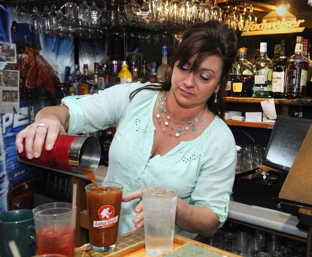 GOOD BUSINESS: Bartender Kerrie Guite pours a Bloody Mary on Friday at Lisa’s Restaurant and Catering on Bangor Street in Augusta.