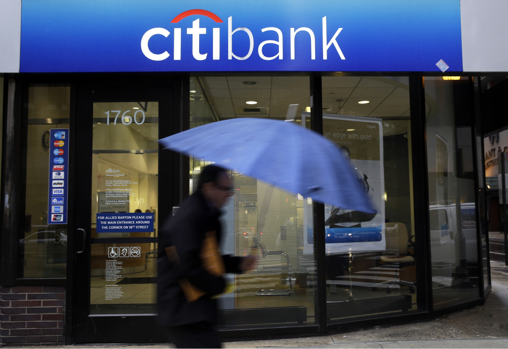 A person walks past a Citibank location in Philadelphia recently. Citigroup Inc., the parent of Citibank, was one of 30 major American banks that passed the Fed’s stress test. The Fed will announce next week whether it has approved each bank’s request, if one has been made, to raise dividends for shareholders.