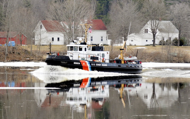 In this 2012 file photo, a Coast Guard ice cutter cruises up the Kennebec River past the Moulton Farm in Pittston. 