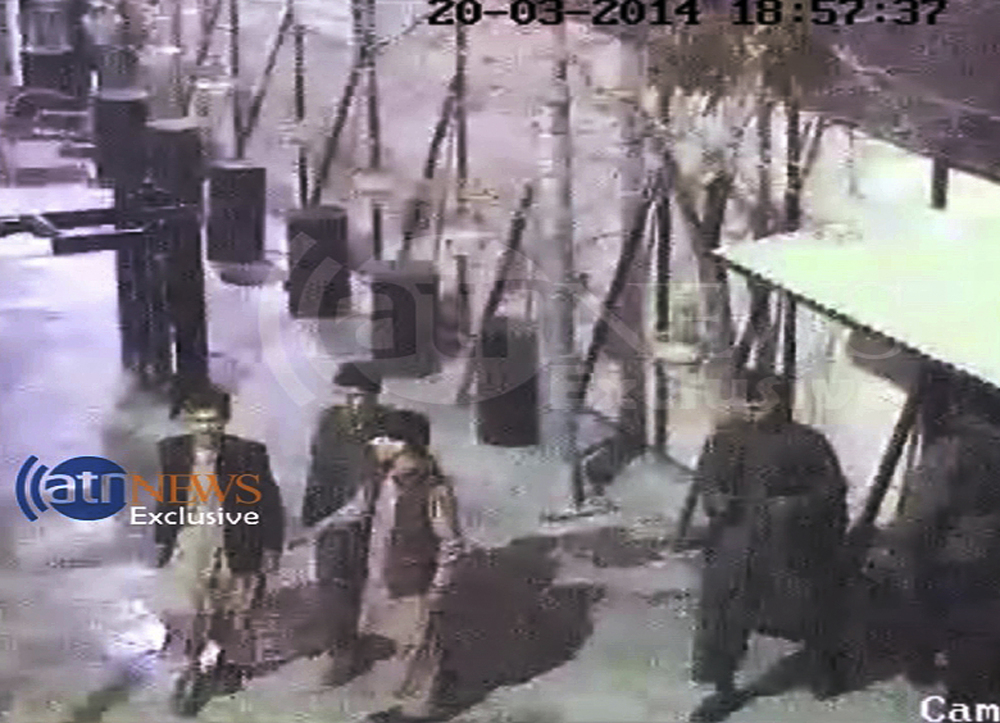 In this frame grab provided from a video by Ariana Television News, four attackers entering the first gate of the Serena hotel in Kabul, Afghanistan on Thursday.