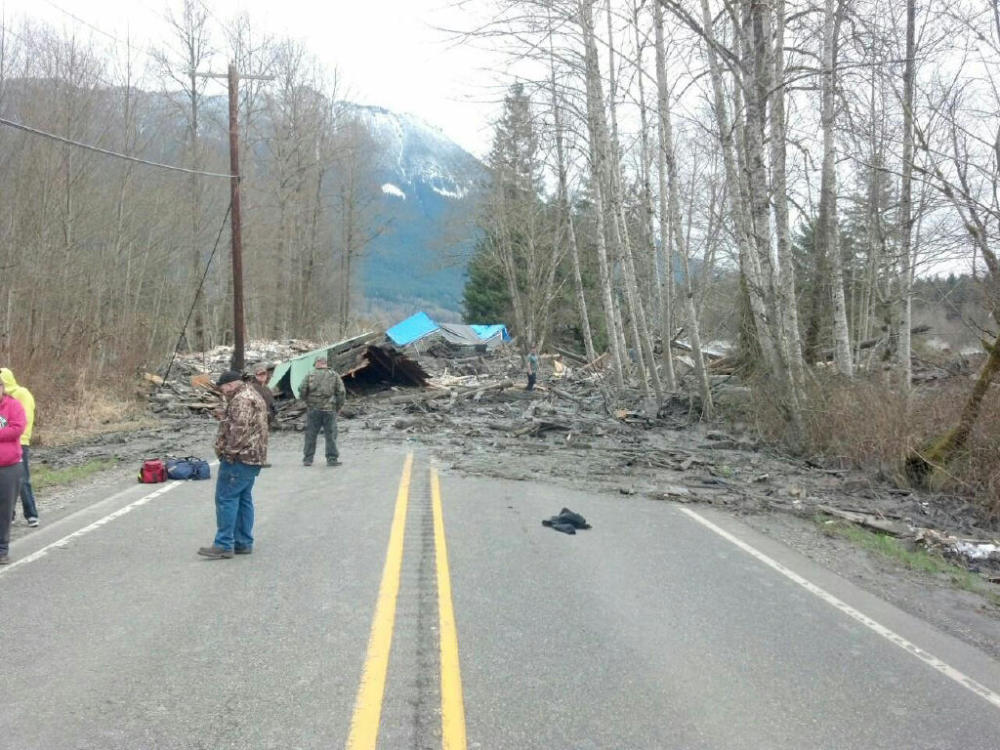 This photo provided by the Washington State Patrol shows the aftermath of a mudslide that moved a house with people inside in Snohomish County on Saturday.