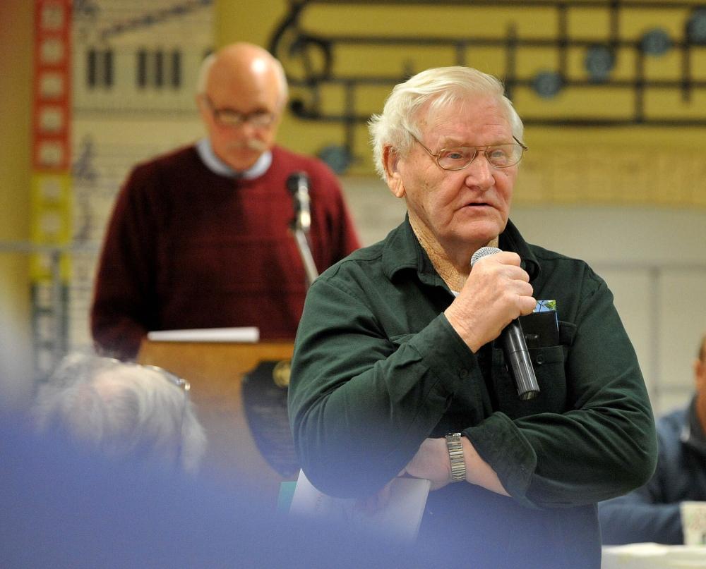Speaking up: Lawrence Tibbetts offers his opinion about cemetery maintenance money during the Town Meeting Saturday morning at J.H. Bean Elementary School in Sidney.