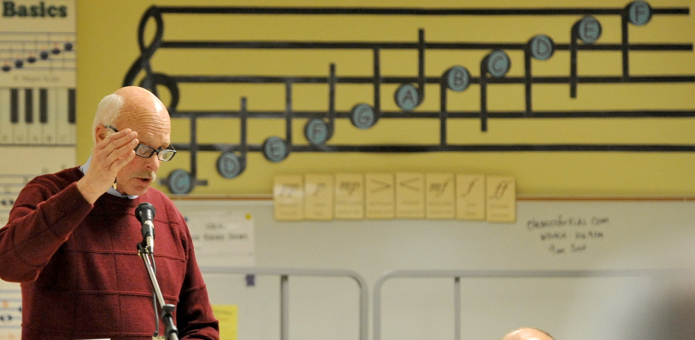 Democracy at work: Wally Buchsmann moderates the Town Meeting at J.H. Bean Elementary School in Sidney on Saturday.