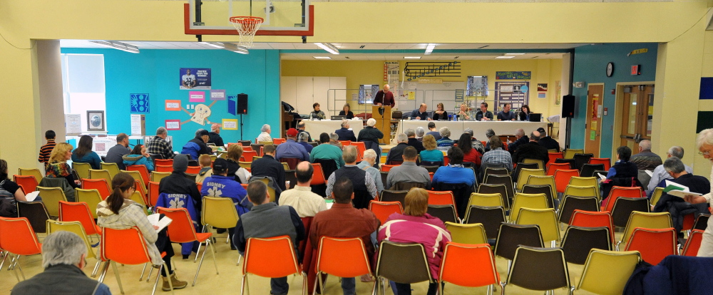 town meeting: Sidney community members gather at J.H. Bean Elementary School to approve the town’s annual budget.