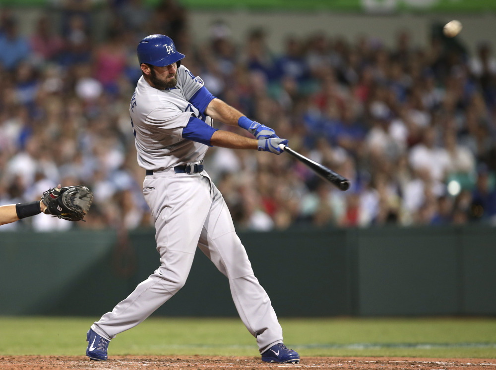 The Los Angeles Dodgers’ Scott Van Slyke hits a two-run home run in the season opener between the Los Angeles Dodgers and Arizona Diamondbacks at the Sydney Cricket ground in Sydney, on Saturday.