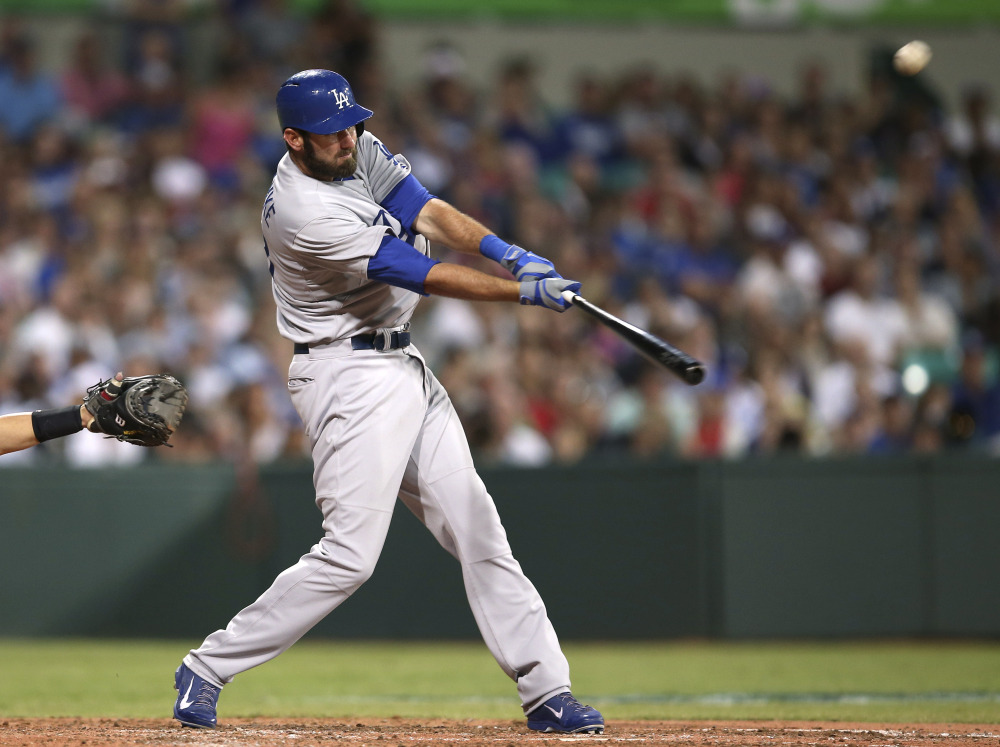 The Los Angeles Dodgers’ Scott Van Slyke hits a two-run home run in the season opener between the Los Angeles Dodgers and Arizona Diamondbacks at the Sydney Cricket ground in Sydney, on Saturday.