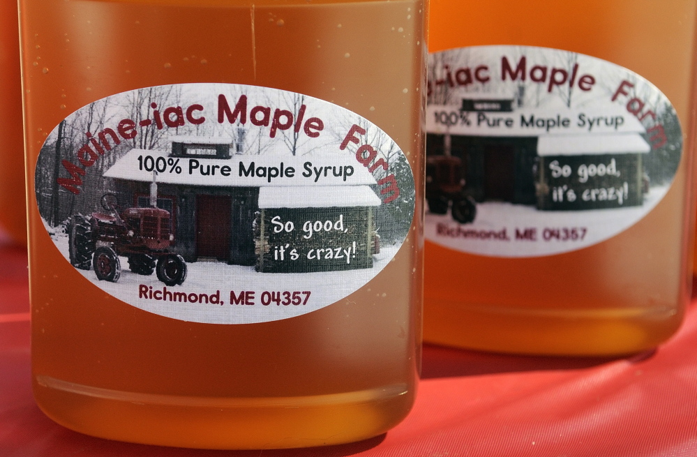 Topping Good: Because the cold weather this year has kept the sap from flowing, only a few pints of syrup have been produced at Maine-iac Maple Farms in Richmond. It was used to top ice cream for visitors on Maine Maple Sunday on Sunday in Richmond.
