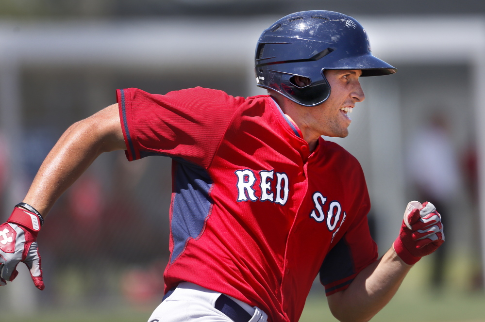 FORT MYERS, FL - MARCH 19: Garin Cecchini, a third baseman in the Boston Red Sox organization, rounds first base while playing in a minor league spring training game vs. the Pittsburgh Pirates in Fort Myers, Fla., March 19, 2014. (Photo by Gabe Souza/Staff Photographer)