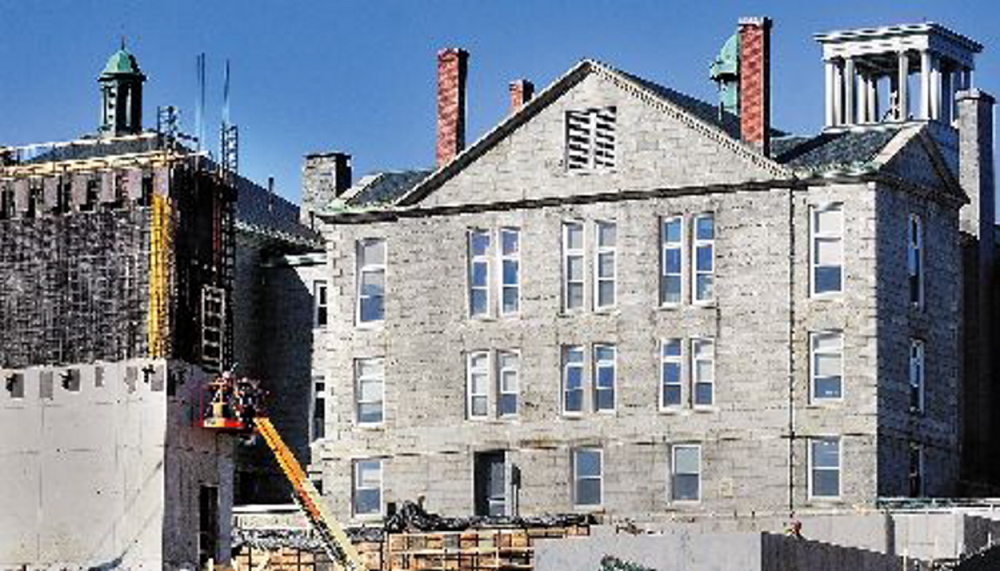 NO JUSTICE: The Kennebec County Courthouse, shown at right in this 2013 file photo, was closed Wednesday afternoon when about 15 gallons of oil leaked from a tank in the basement.