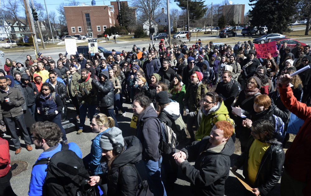 Students and faculty protest cuts at the University of Southern Maine on Monday.