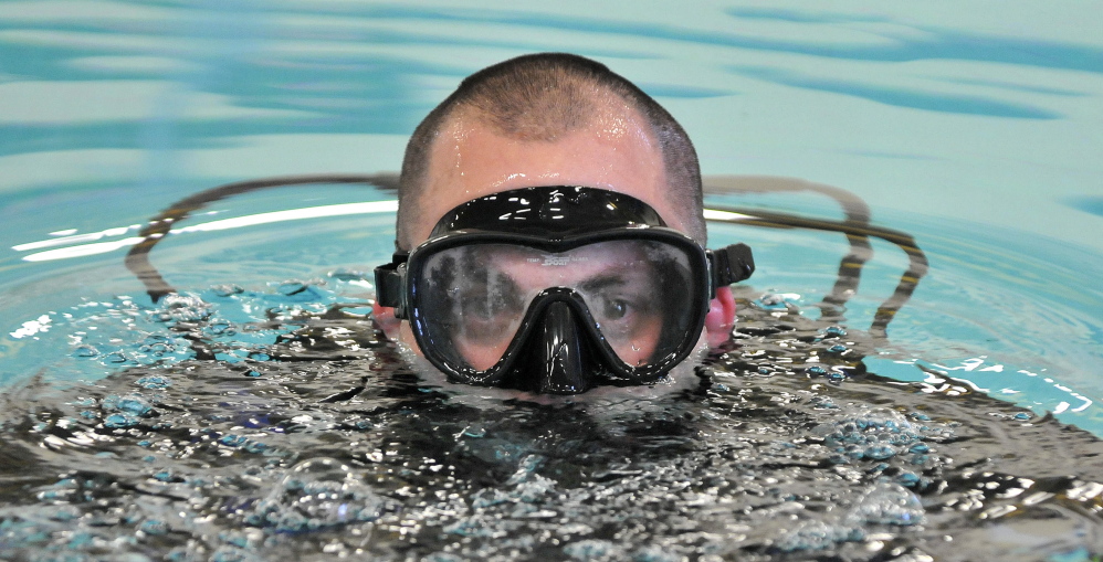 in the water: Josh Hardy, a Kennebec County Sheriff’s Office detective, participates in dive training Tuesday.