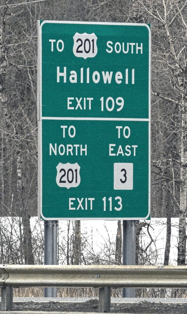 SIGN LANGUAGE: Signs such as these that direct drivers to smaller cities and towns would be taken down under a proposal from the Maine Department of Transportation and Maine Turnpike Authority.