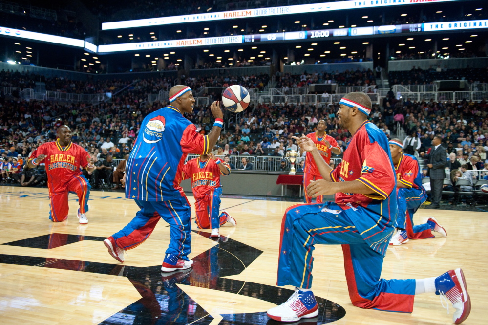THEY’RE BACK: Members of the Harlem Globetrotters, including guard Dizzy Grant, left, warm up before a game earlier this season. The Globetrotters will be at the Augusta Civic Center on Monday night.