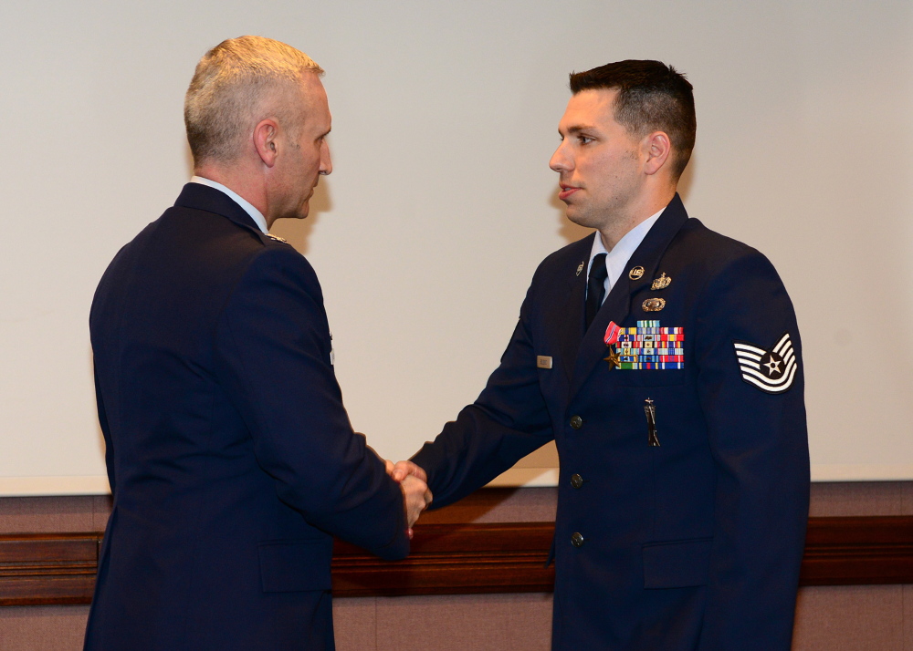 High honor: Air Force Tech Sgt. Matt Bolduc, of Oakland, right, shakes hands with Air Force Col. Jeff Hurlbert after Bolduc was awarded the Bronze Star earlier this month.