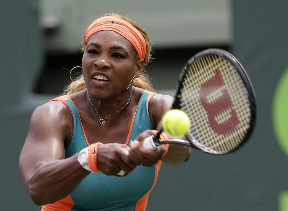Serena Williams returns to Li Na during the women’s final at the Sony Open Tennis tournament in Key Biscayne, Fla., on Saturday. Williams won her seventh Key Biscayne title, 7-5, 6-1.