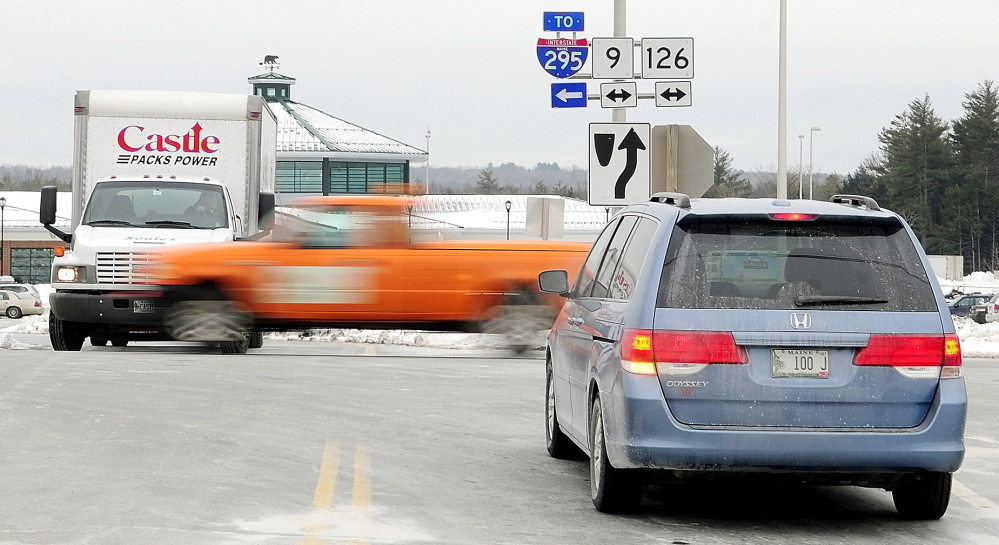 HAZARDOUS SITE: Drivers entering and leaving the West Gardiner Service Plaza wait for a break in traffic in February on Routes 9 and 126 in West Gardiner. The Maine Department of Transportation plans to build a roundabout there.