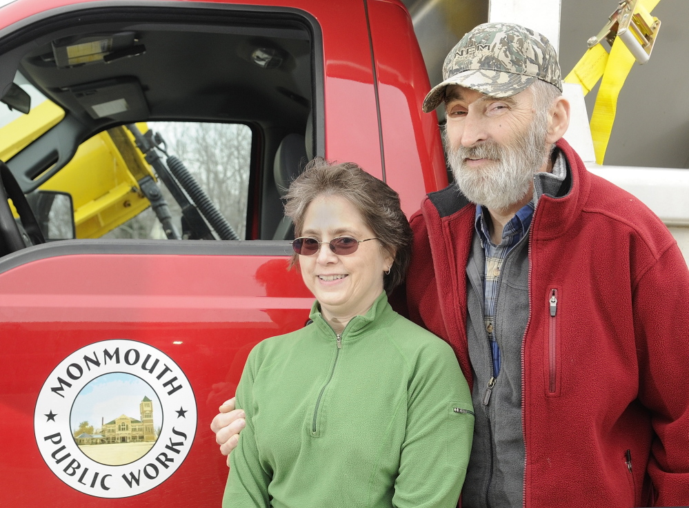 GRATEFUL: Cathy Crocker poses with husband Leonard Crocker beside a Monmouth Public Works truck on Friday at the town garage. Cathy Crocker learned only upon arriving at a Lewiston hospital that her husband had suffered a heart attack, not complications from diabetes.