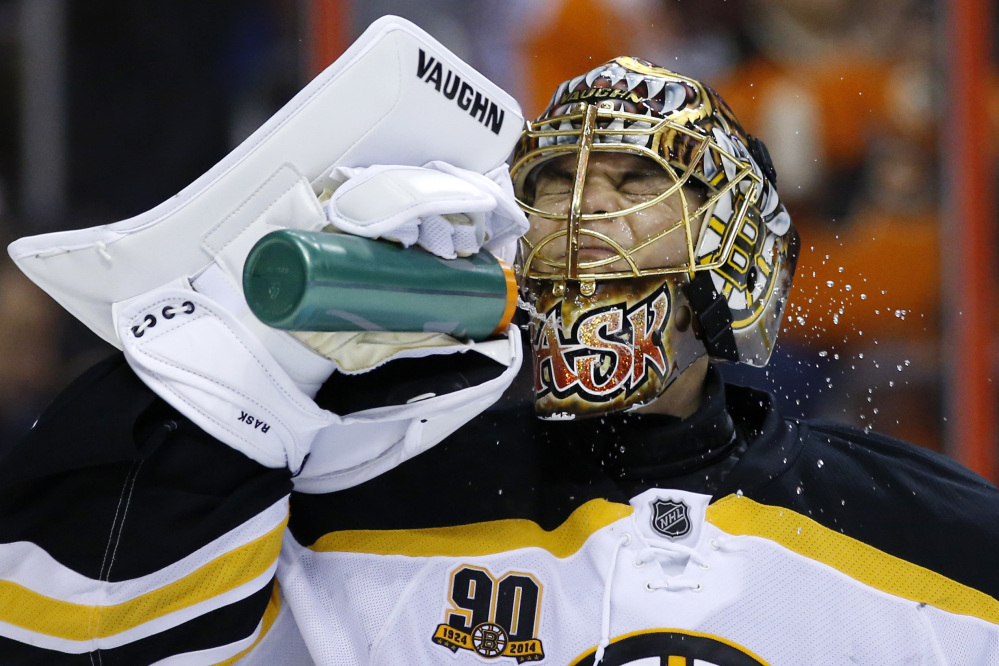 Bruins goalie Tuukka Rask cools off during a break in the second period of Sunday’s game at Philadelphia. The Bruins won 4-3 in a shootout,