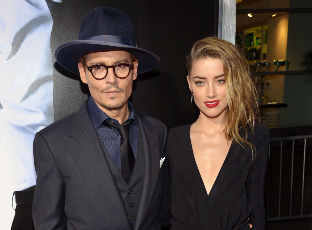 Johnny Depp and Amber Heard are shown together in February. Depp on Monday indirectly confirmed rumors of his engagement to actress Amber Heard.