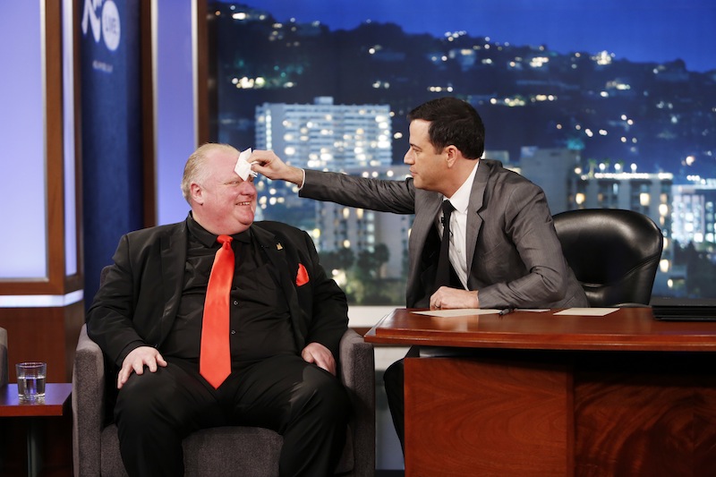 This March 3, 2014 image released by ABC shows Toronto Mayor Rob Ford, left, having his forehead wiped by host Jimmy Kimmel on the late night talk show "Jimmy Kimmel Live," in Los Angeles. Ford laughed off Jimmy Kimmel's suggestion that he get help for his drinking problem and was reported to be upset about his appearance on the late-night TV talk show. Ford's appearance Monday night on "Jimmy Kimmel Live" in Los Angeles was the culmination of months of wooing by the talk-show host to get Ford to appear as a guest.