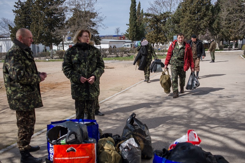 Ukrainian servicemen pile up their things after leaving the Ukrainian navy headquarters stormed by Crimean pro-Russian self-defense forces in Sevastopol, Crimea, on Wednesday. Crimea's self-defense forces on Wednesday stormed the Ukrainian navy headquarters in the Black Sea port of Sevastopol, taking possession without resistance a day after Russia signed a treaty with local authorities to annex the region.