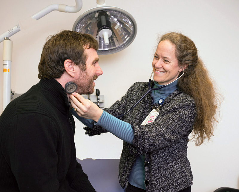Dr. Stephanie Calkins examines a patient at Four Seasons Family Practice in Fairfield.