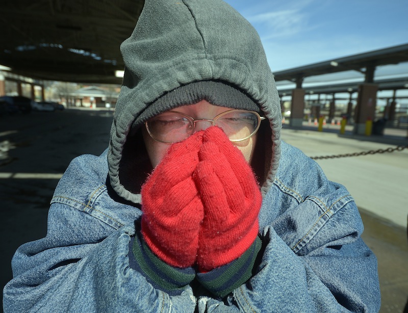Dana Maxwell tries to keep warm at Intermodal Transportation Center in Fort Worth, Texas, Monday, March 3, 2014. The couple said that they are homeless and had to leave the Presbyterian Night Shelter at 7 a.m. and plan to ride the bus all day to keep warm. The National Weather Service issued a wind chill advisory until midmorning Monday for the Dallas-Fort Worth area. Forecasters say sunny conditions should return by Tuesday with highs in the upper 40s.
