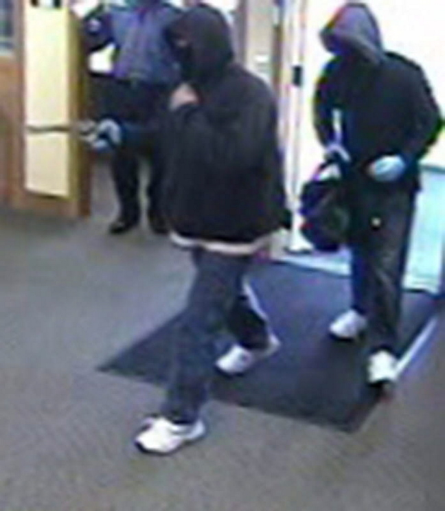 A bank surveillance camera shows the men who robbed a Kennebunk Savings Bank branch in Eliot in October.