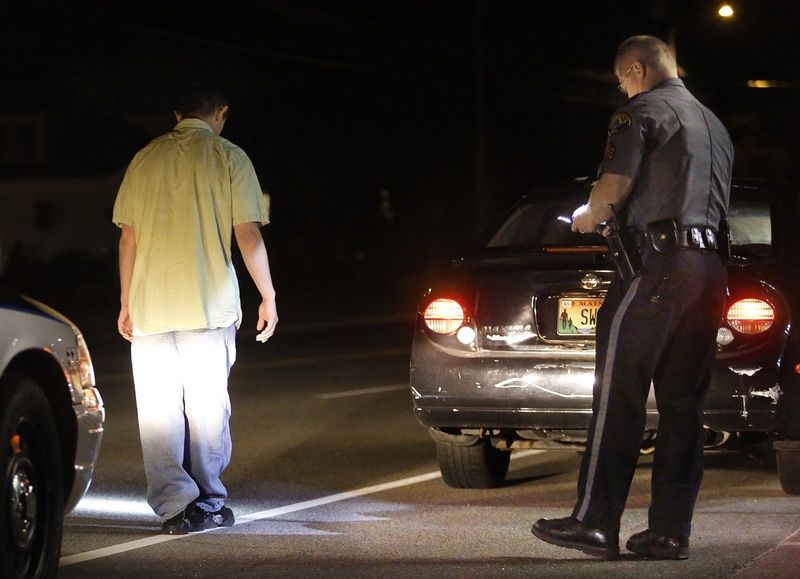 In this 2012 file photo, Scarborough police Sgt. Tom Chard conducts a sobriety test after stopping a motorist during an OUI detail on Route 1. The Maine Legislature approved a bill Wednesday that would hold repeat drunken-driving offenders more accountable.