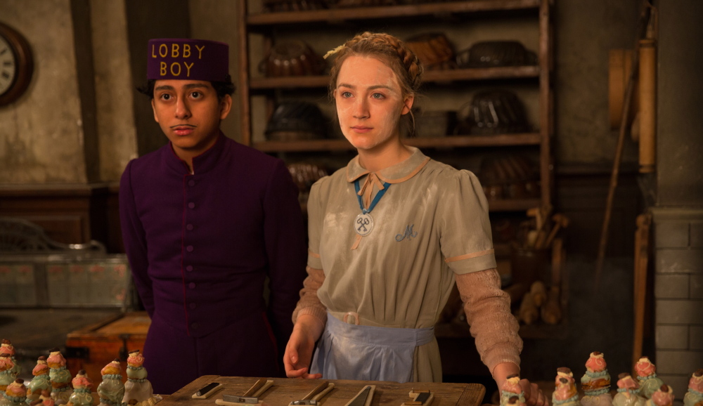 This image released by Fox Searchlight shows Tony Revolori, left, and Saoirse Ronan in "The Grand Budapest Hotel." (AP Photo/Fox Searchlight)