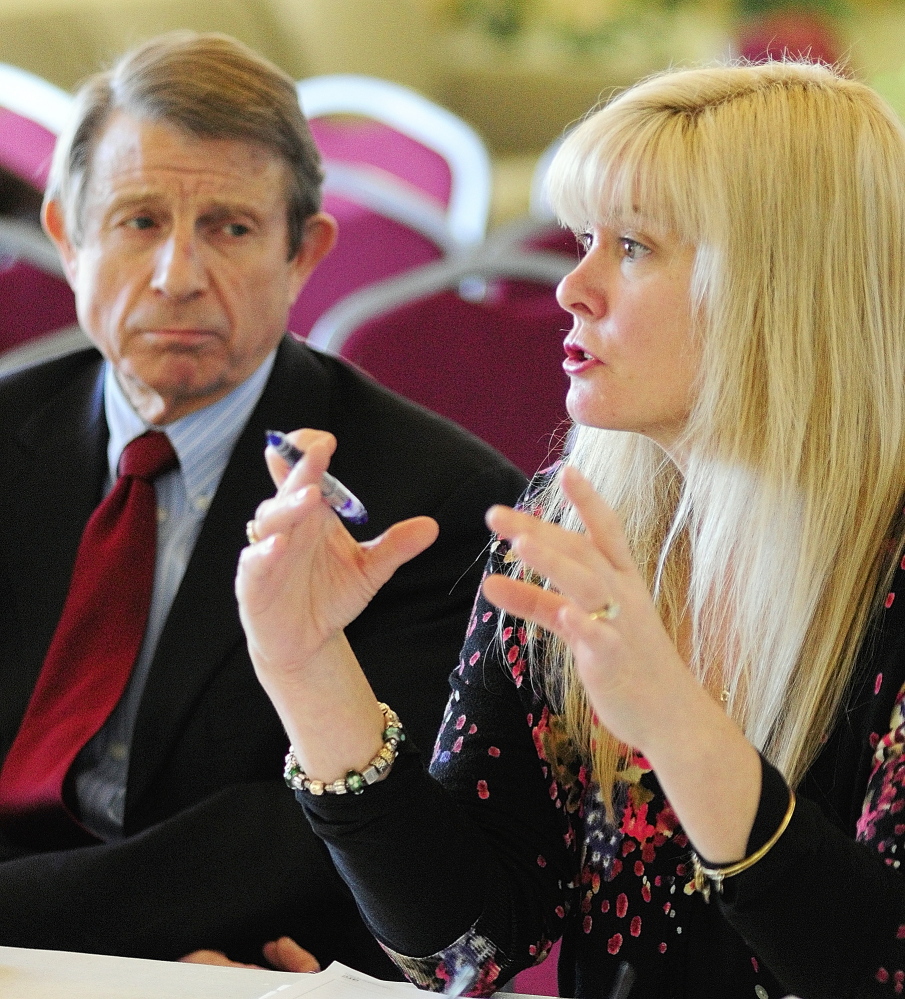 VIRTUALLY UNASSURED: Maine Virtual Academy board secretary Peter Mills, left, listens as board chairwoman Amy Carlisle answers a question from the state Charter School Commission in February during an in-depth interview at University of Maine at Augusta.