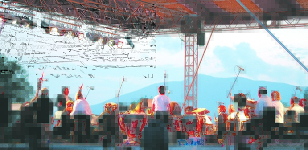 IN TUNE: The Bangor Symphony Orchestra plays at the annual Kingfield POPS concert with the western mountains as a backdrop.