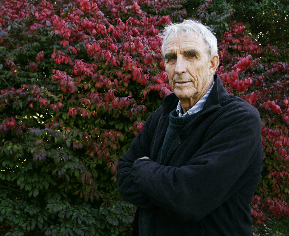 Peter Matthiessen stands in his yard in Sagaponack, N.Y., in 2004.