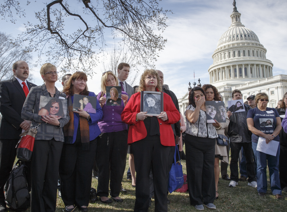 Families of victims of a General Motors safety defect gather at Capitol Hill in Washington on April 1.