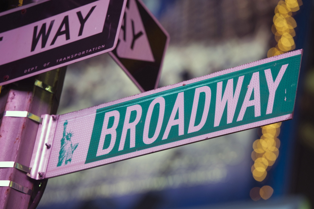 A street sign in Times Square marks Broadway in New York City. A proposed change in the federal tax code would allow live theater investment to be deducted up to $15 million per production.