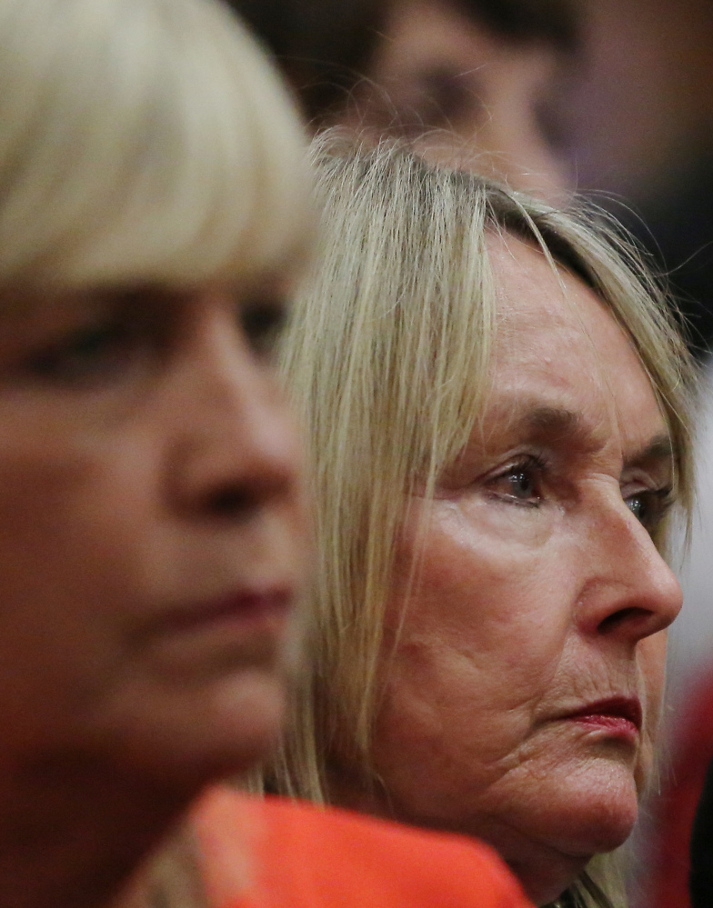 June Steenkamp, right, mother of the late Reeva Steenkamp listens to evidence by a pathologist during the murder trial of Osacr Pistorius in court in Pretoria, South Africa, Monday, April 7, 2014. Pistorius is charged with murder for the shooting death of his girlfriend Reeva Steenkamp, on Valentines Day 2013.