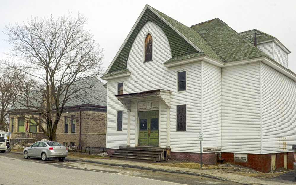 RIPE FOR EXPANSION: The C.M. Bailey Library, left, is shown next to the old Masonic Hall on Tuesday in Winthrop. The town plans to demolish the hall and add a wing on the adjacent Bailey Library.