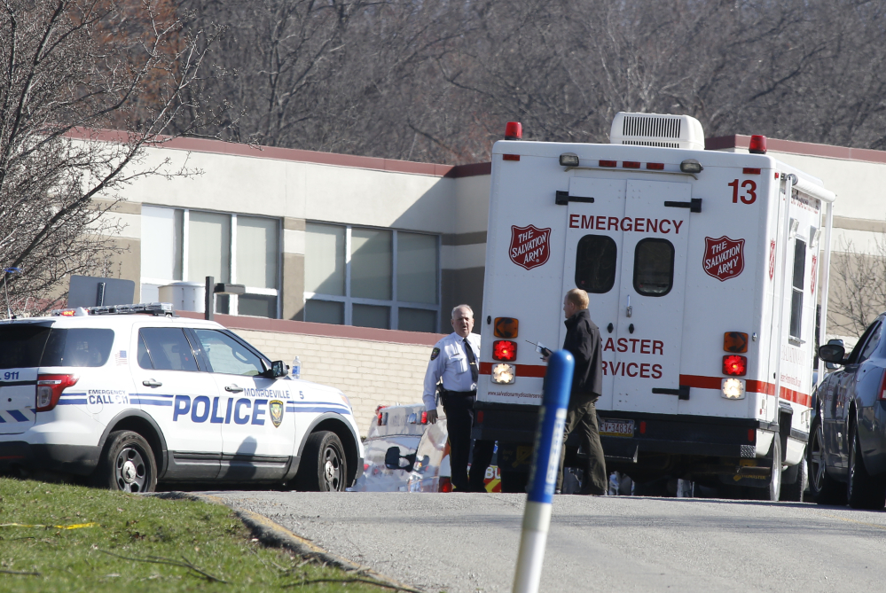 Emergency responders gather in the parking lot of the high school on the campus of the Franklin Regional School District where several people were stabbed at Franklin Regional High School on Wednesday, April 9, 2014, in Murrysville, Pa., near Pittsburgh. The suspect, a male student, was taken into custody and being questioned.