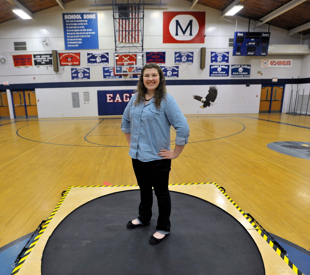 Staff photo by Michael G. Seamans Messalonskee High School sophomore, Emily Steinmeyer, 15, stands with her shot-put circle used for training during track practice at Messalonskee High School in Oakland.
